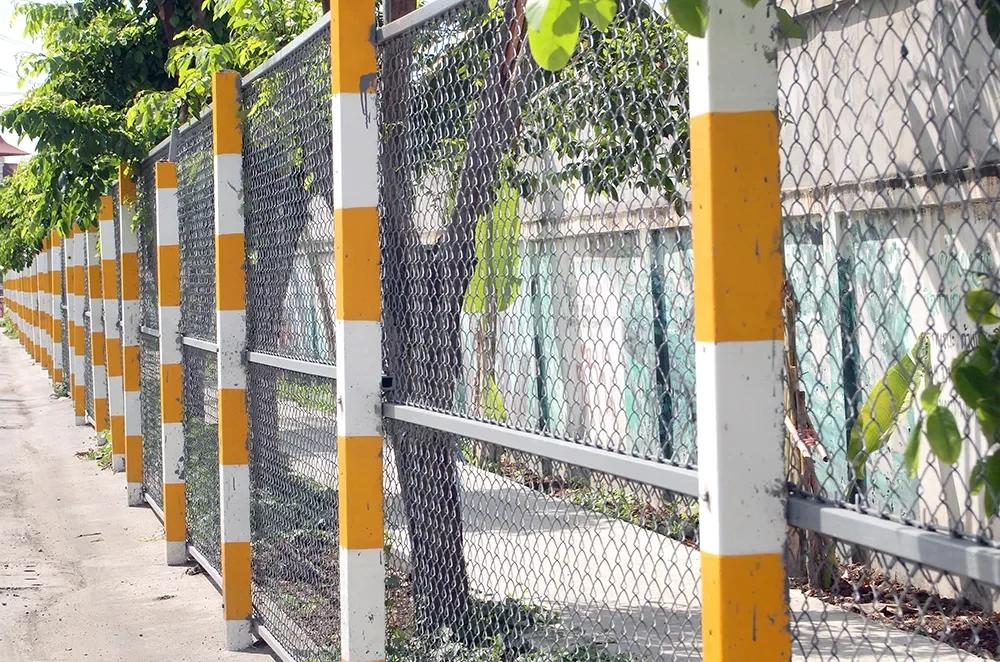 fence-by-railing-against-trees